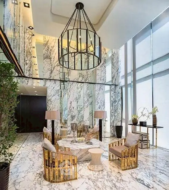 Luxurious modern living room with marble walls and floor, elegant chandelier, and stylish furniture.