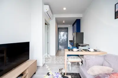 Modern living room with open kitchen and stylish decor in a cozy apartment