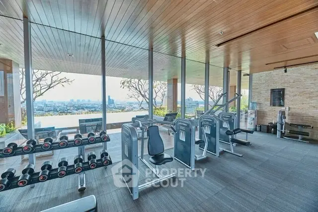 Luxury gym with panoramic city view and modern equipment