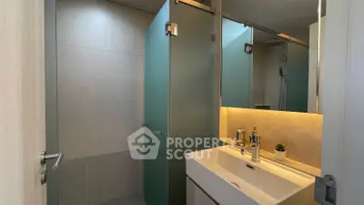 Modern bathroom with sleek design and ambient lighting