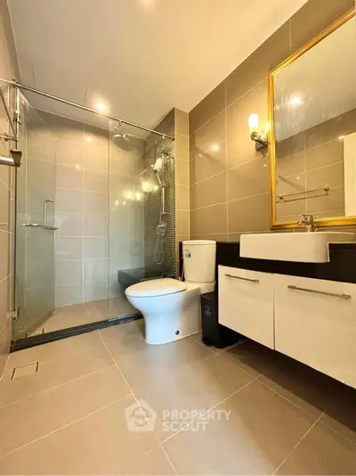 Modern bathroom with glass shower and elegant fixtures