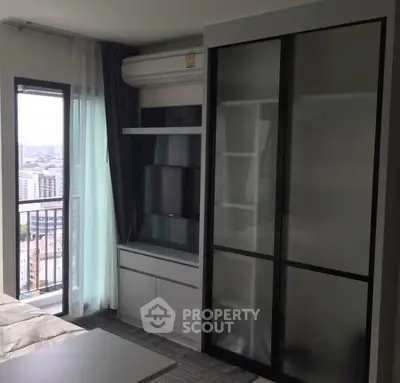 Modern bedroom with city view and sleek storage solutions