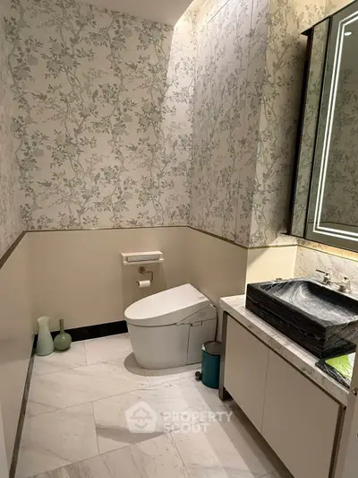 Luxurious bathroom with elegant wallpaper and modern fixtures