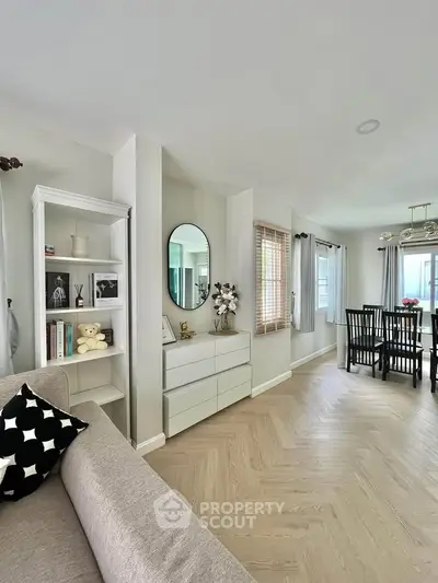 Stylish open-plan living and dining area with modern decor and natural light.