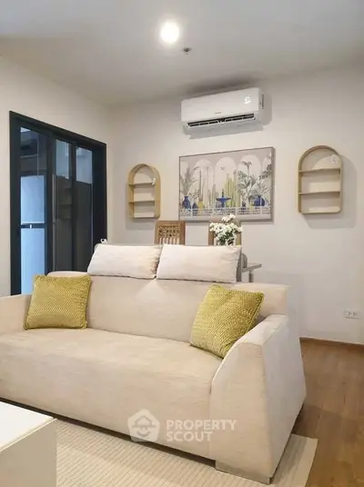 Modern living room with cozy beige sofa and stylish decor