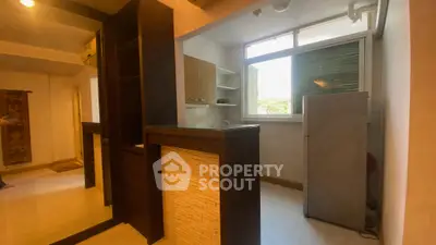 Cozy kitchen with open layout and modern appliances in a bright apartment