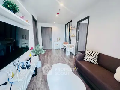 Modern living room with stylish decor and wooden flooring