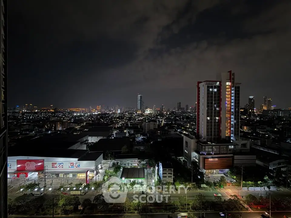 Stunning cityscape night view from high-rise apartment balcony showcasing vibrant urban skyline.