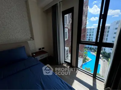 Modern bedroom with pool view in luxury apartment