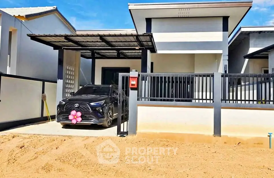 Modern single-story house with carport and sleek exterior design