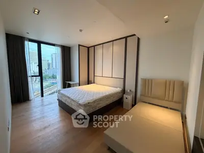 Spacious modern bedroom with city view and elegant furnishings