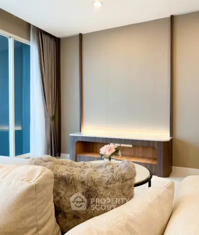 Elegant living room with plush sofa and modern decor, perfect for relaxation and entertaining.