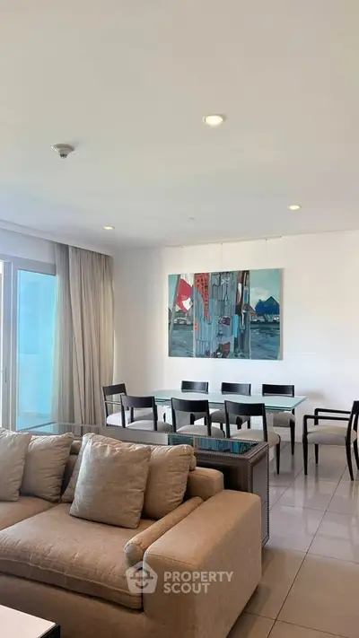 Spacious modern living room with elegant dining area and large windows