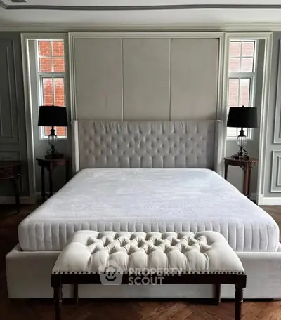 Luxurious bedroom with elegant tufted bed and stylish decor