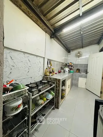 Charming kitchen with gas stove and ample storage space
