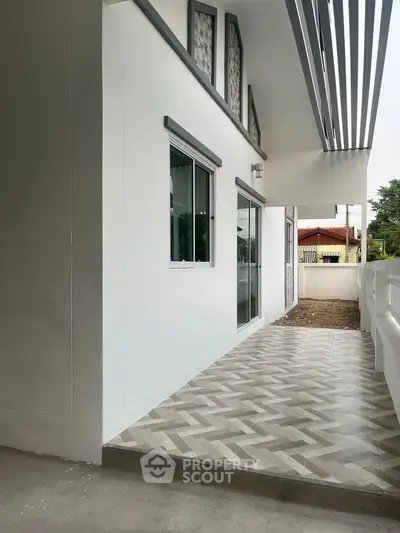 Modern balcony with stylish tiles and sleek design, perfect for relaxation and outdoor enjoyment.