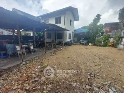 Spacious backyard with potential for renovation in suburban property.