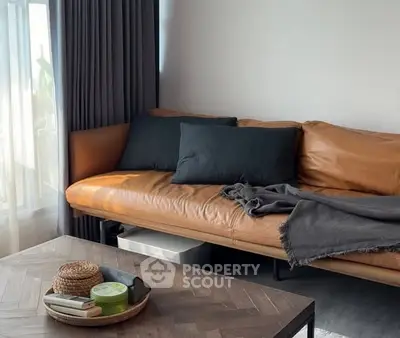 Stylish living room with leather sofa and modern decor