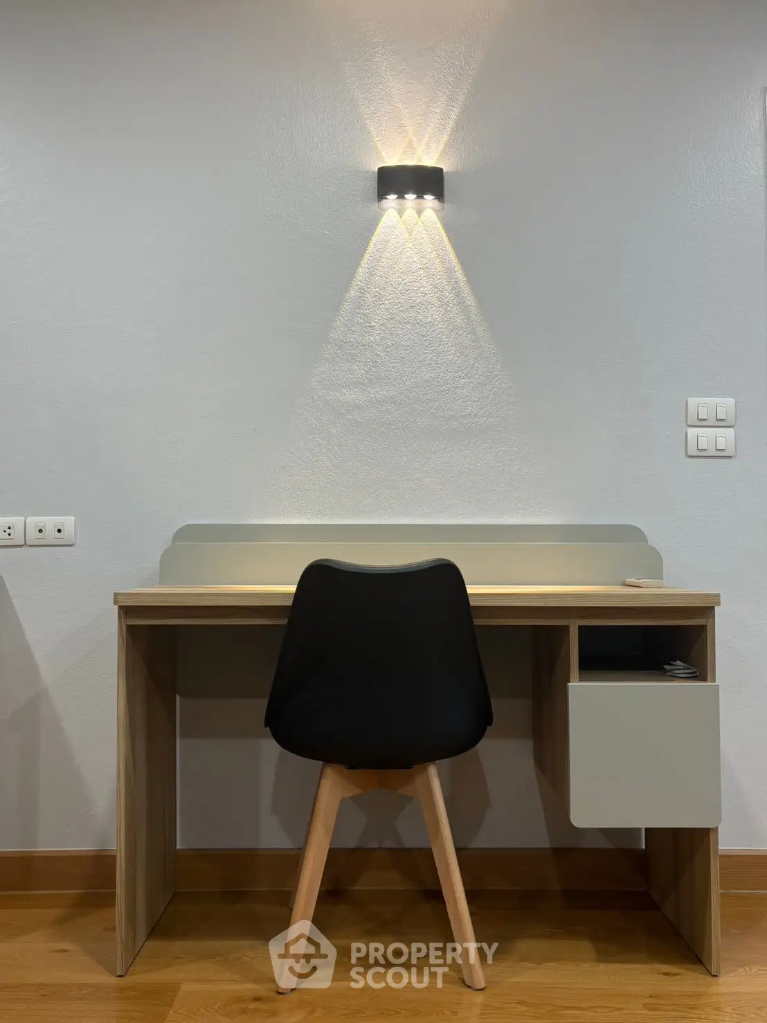 Modern study area with sleek desk and chair, perfect for productivity and style.