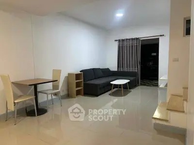 Modern living room with sleek furniture and natural light