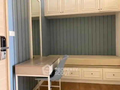 Cozy study nook with built-in storage and elegant paneling