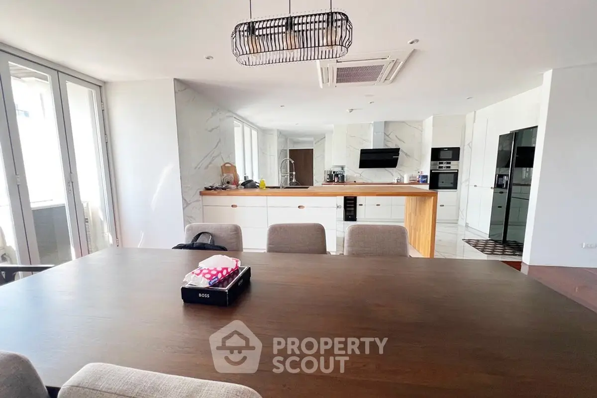 Spacious modern kitchen with open layout and elegant dining area