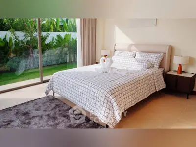 Luxurious bedroom with garden view and elegant decor in modern home