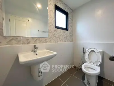Modern bathroom with sleek fixtures and stylish tile design.