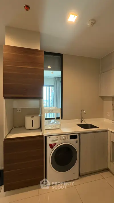 Modern kitchen with integrated washing machine and sleek cabinetry