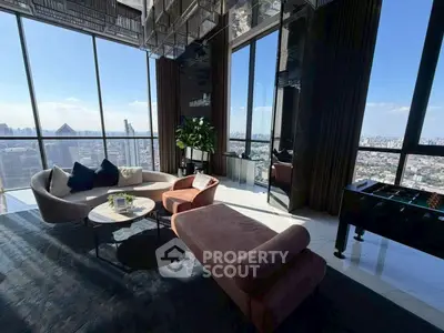 Luxurious high-rise living room with panoramic city views and modern furnishings.