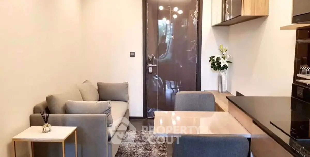 Modern compact living room with cozy sofa and stylish dining area