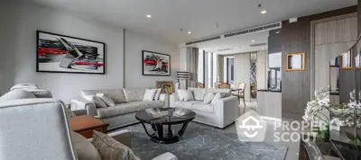 Luxurious modern living room with elegant decor and spacious seating area.