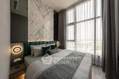 Luxurious bedroom with floor-to-ceiling windows and elegant decor