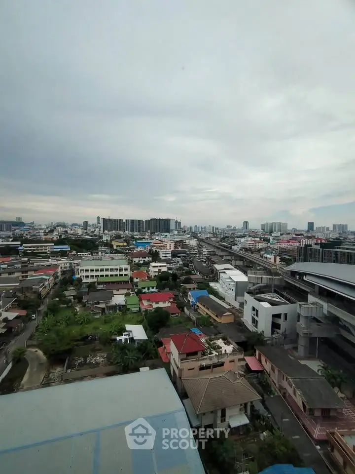 Stunning cityscape view from high-rise building showcasing urban skyline and vibrant neighborhood.