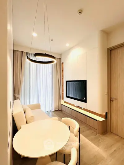 Modern living room with elegant lighting and cozy seating area