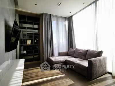 Modern living room with large windows and cozy sectional sofa