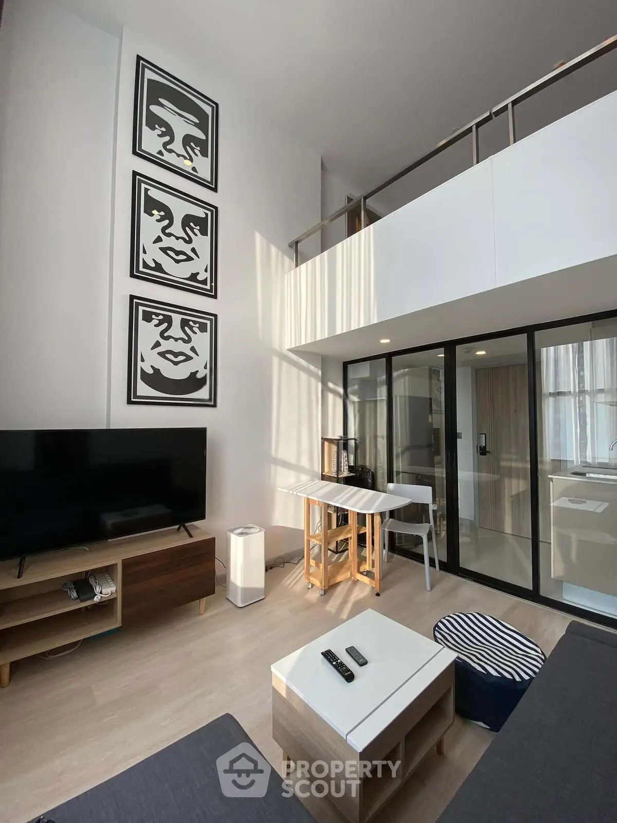 Modern loft-style living room with high ceilings and stylish decor