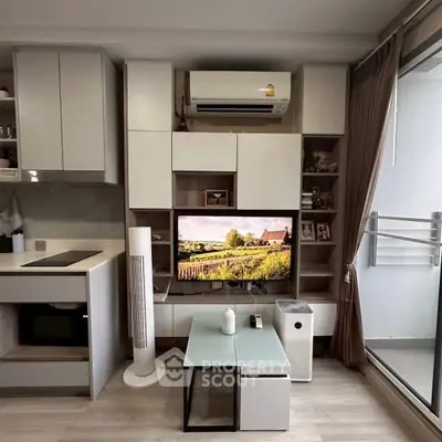 Modern living room with sleek storage, air conditioning, and balcony access.