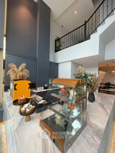 Modern interior with high ceilings and elegant decor in a stylish living space.