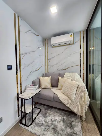 Cozy modern living room with elegant marble accents and plush seating