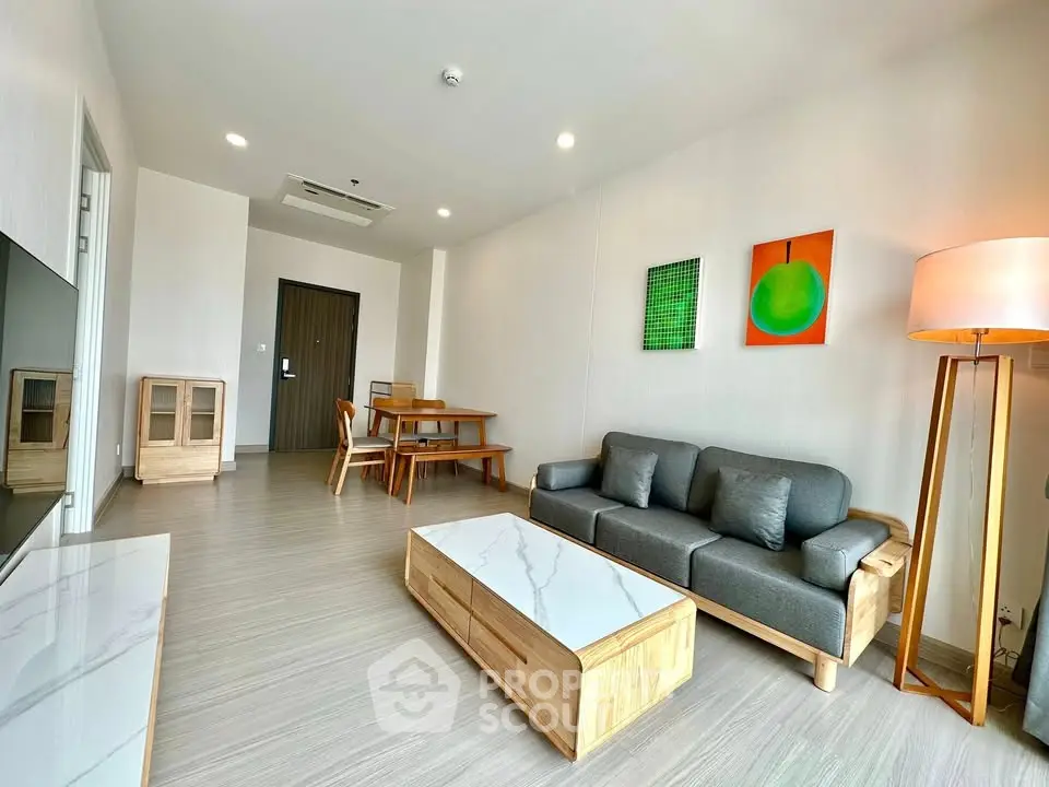 Modern living room with stylish furniture and contemporary decor in a spacious apartment.