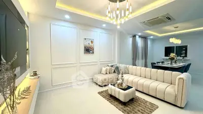 Luxurious living room with elegant lighting and modern decor