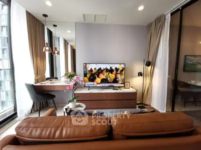 Modern living room with stylish decor and large windows