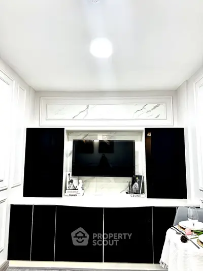 Elegant living room with modern black and white entertainment center