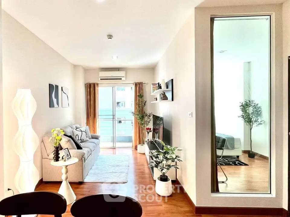 Modern living room with stylish decor and balcony access