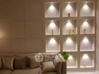 Elegant living room with modern wall shelving and cozy sofa