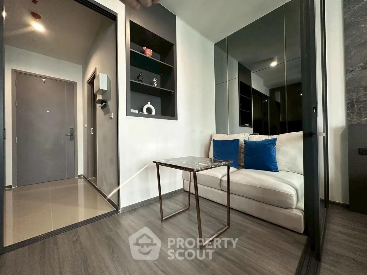 Modern living room with sleek design and cozy seating area