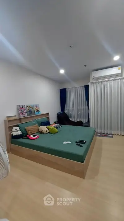 Spacious bedroom with modern decor and large bed in a cozy apartment