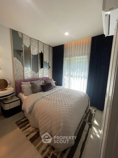 Luxurious bedroom with elegant decor and natural light, featuring plush bedding and stylish curtains.