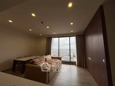 Spacious living room with stunning city view and modern decor